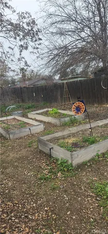 a backyard of a house with a yard and outdoor seating