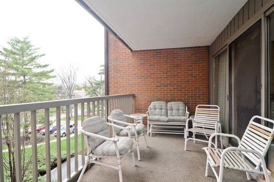 44 Park Lane, Unit 324 Park Ridge, IL 60068 - Photo 14 of 15 a balcony view with a couple of chairs