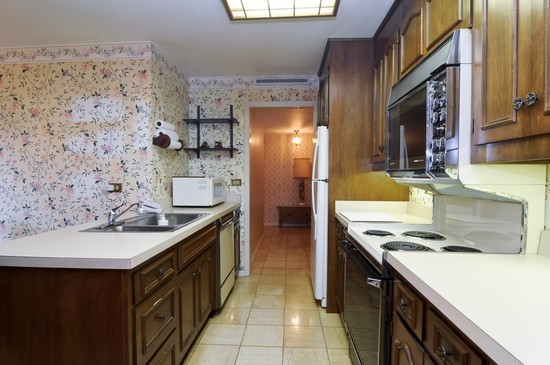44 Park Lane, Unit 324 Park Ridge, IL 60068 - Photo 4 of 15 a kitchen with stainless steel appliances granite countertop a sink stove and refrigerator