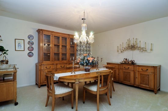 44 Park Lane, Unit 324 Park Ridge, IL 60068 - Photo 7 of 15 a view of a dining room with furniture and chandelier
