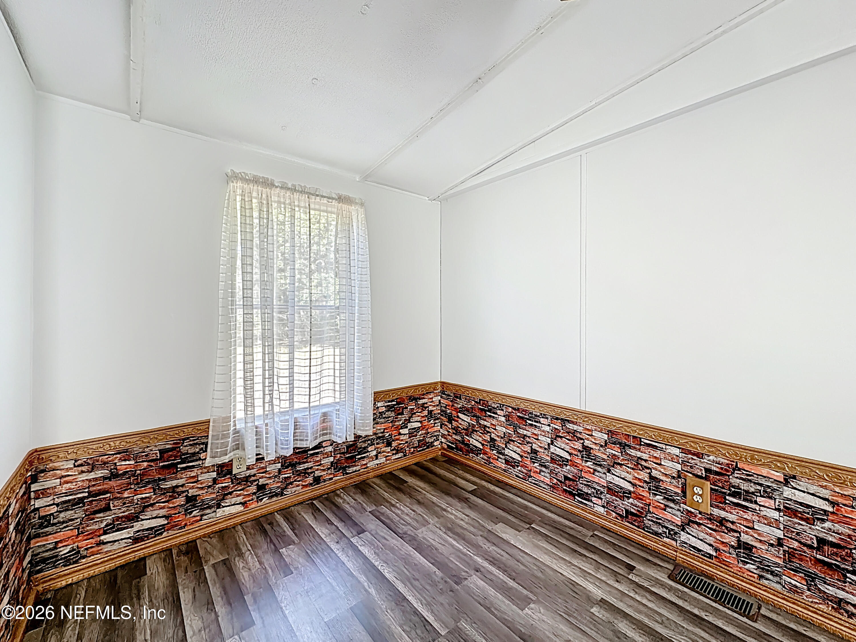 133 Reaves Avenue Interlachen, FL 32148 - Photo 11 of 38 a view of a room with wooden floor