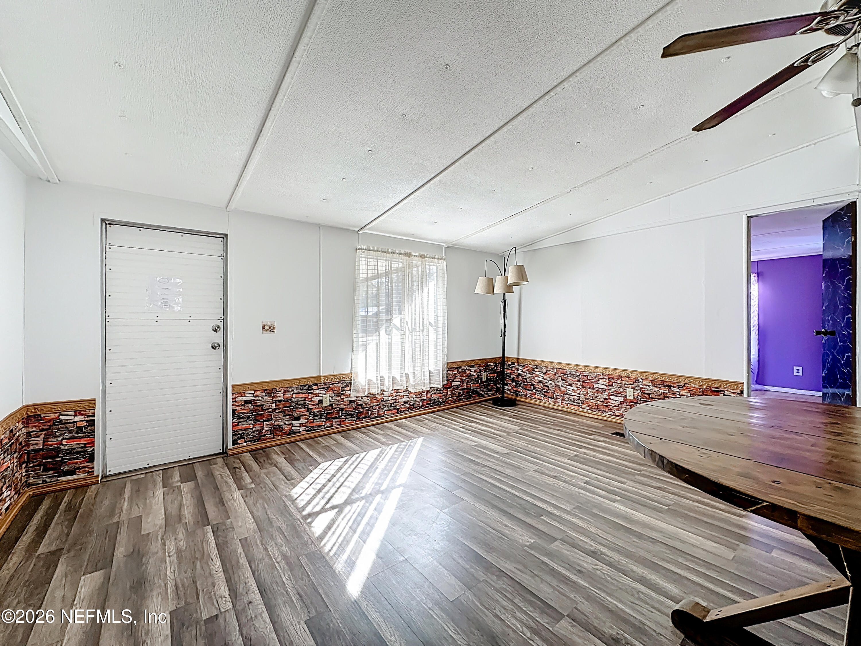 133 Reaves Avenue Interlachen, FL 32148 - Photo 10 of 38 a view of a room with wooden floor