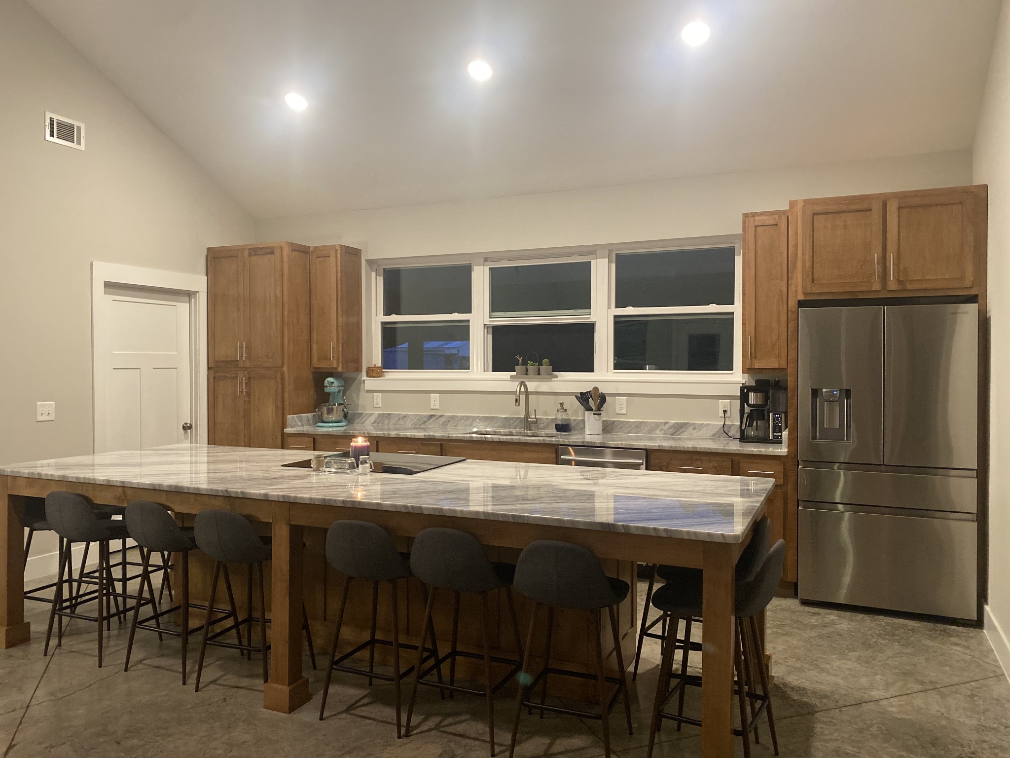 201 B Roberts Road Portland, TN 37148 - Photo 4 of 11 a kitchen with refrigerator a sink and chairs