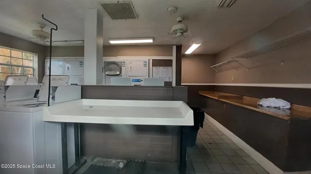 swimming pool view with a seating space