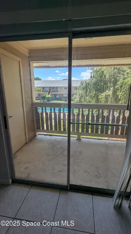 an empty room with a empty space and windows