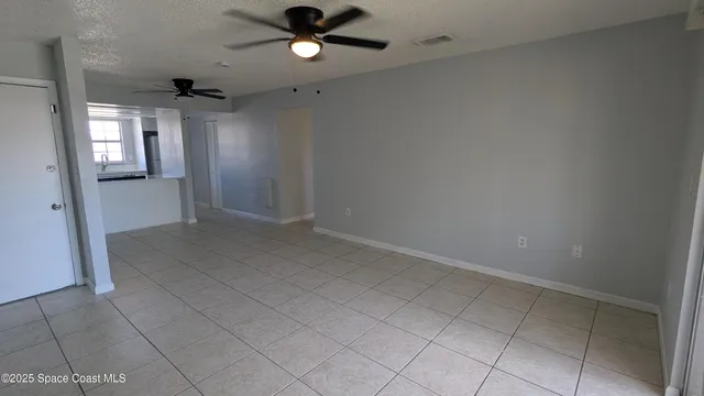 an empty room that has a window in it