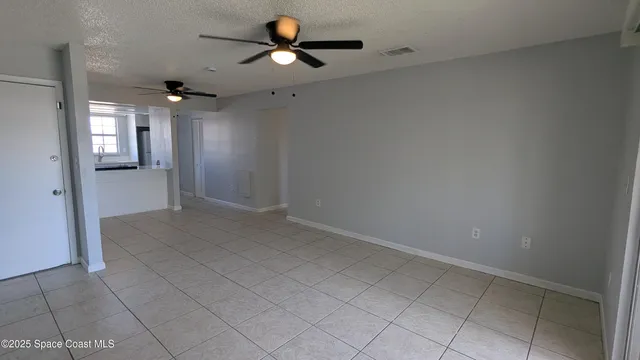 a white refrigerator freezer sitting inside of a kitchen