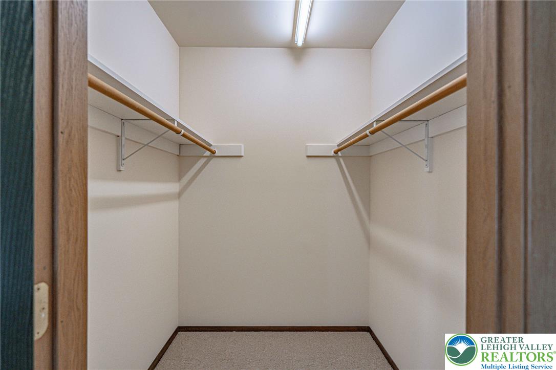 25 North 8th Street Emmaus, PA 18049 - Photo 33 of 51 Ample hanging space and shelving define this practical walk-in closet, ready for personalized organization.