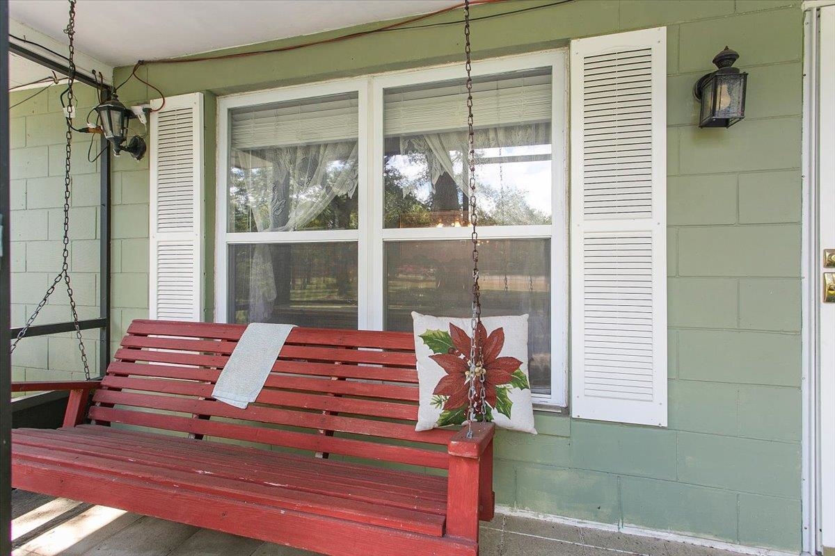 3351 Pacetti Road St. Augustine, FL 32092 - Photo 2 of 24 a backyard of a house with wooden floor and glass windows