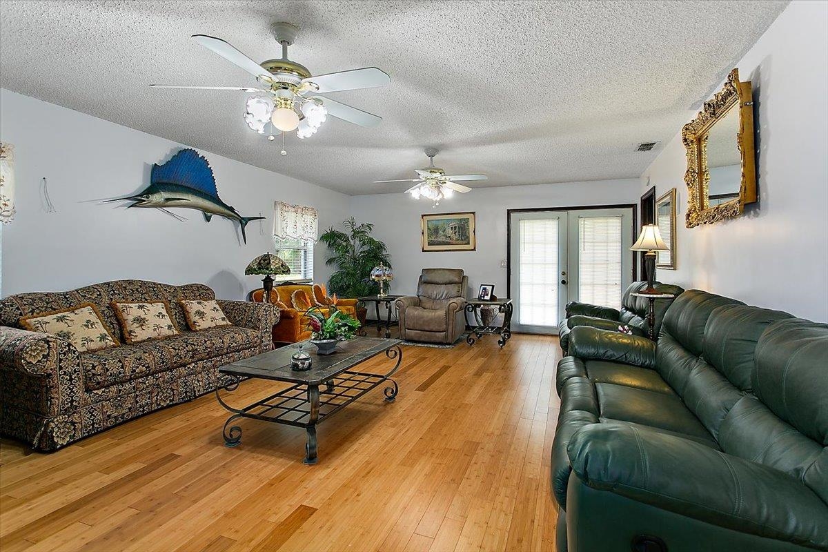 3351 Pacetti Road St. Augustine, FL 32092 - Photo 3 of 24 a living room with furniture and a chandelier