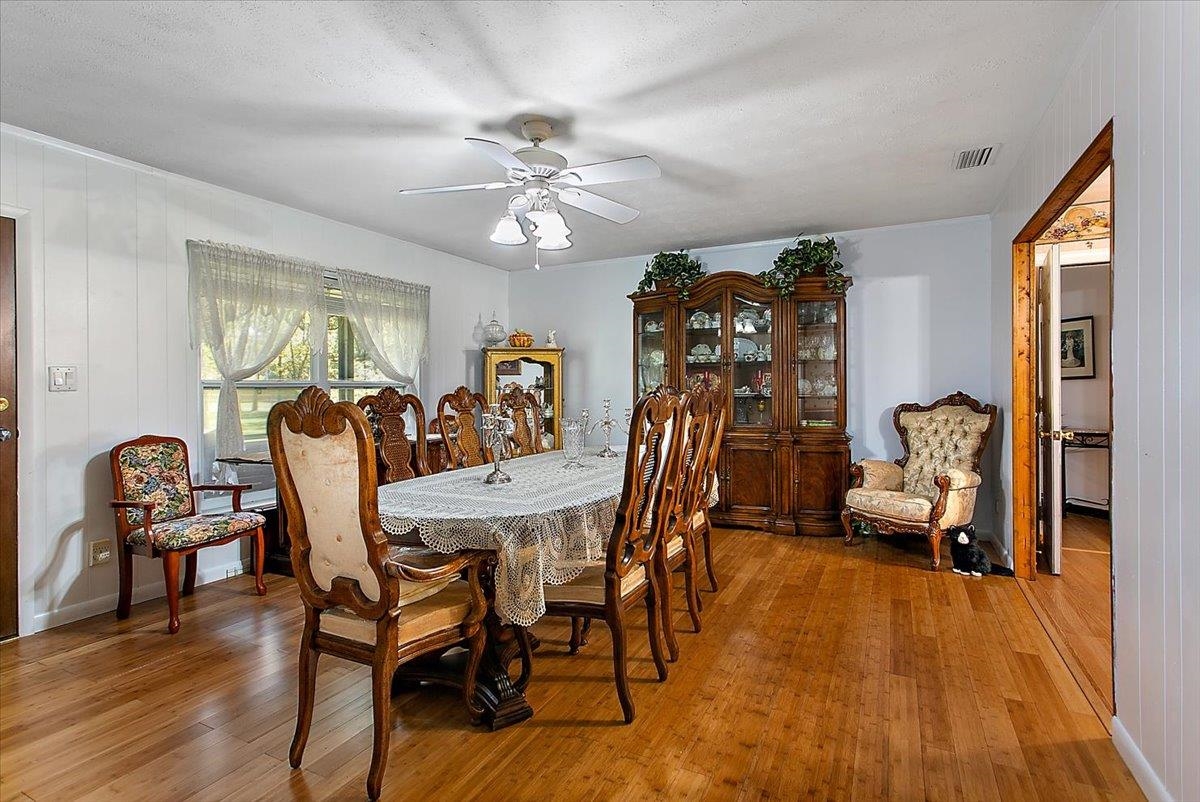 3351 Pacetti Road St. Augustine, FL 32092 - Photo 5 of 24 a view of a dining room with furniture window and wooden floor