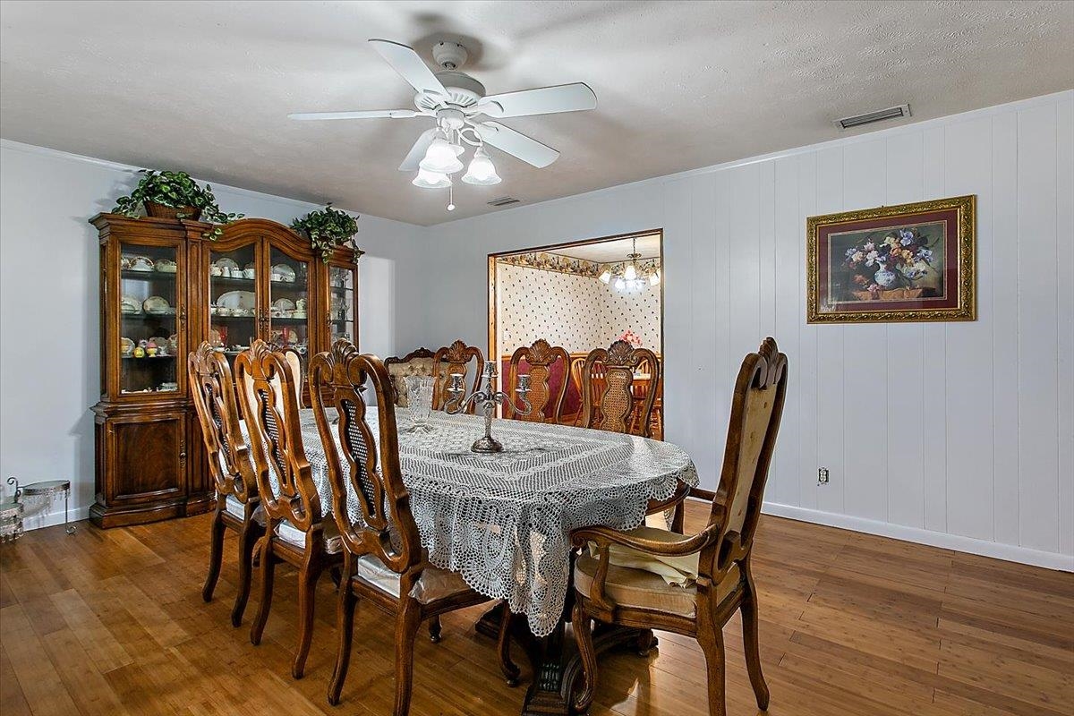 3351 Pacetti Road St. Augustine, FL 32092 - Photo 6 of 24 a view of a dining room with furniture and wooden floor