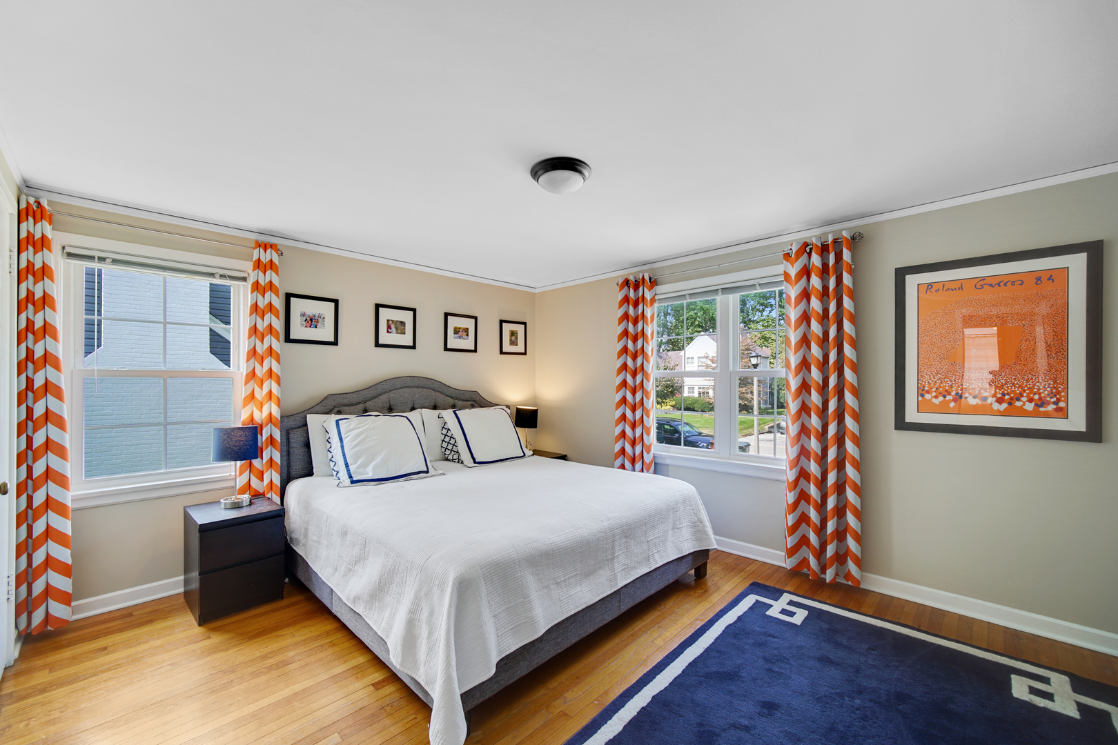 92 Williamsburg Road Evanston, IL 60203 - Photo 11 of 14 a bedroom with a bed and a painting on the wall
