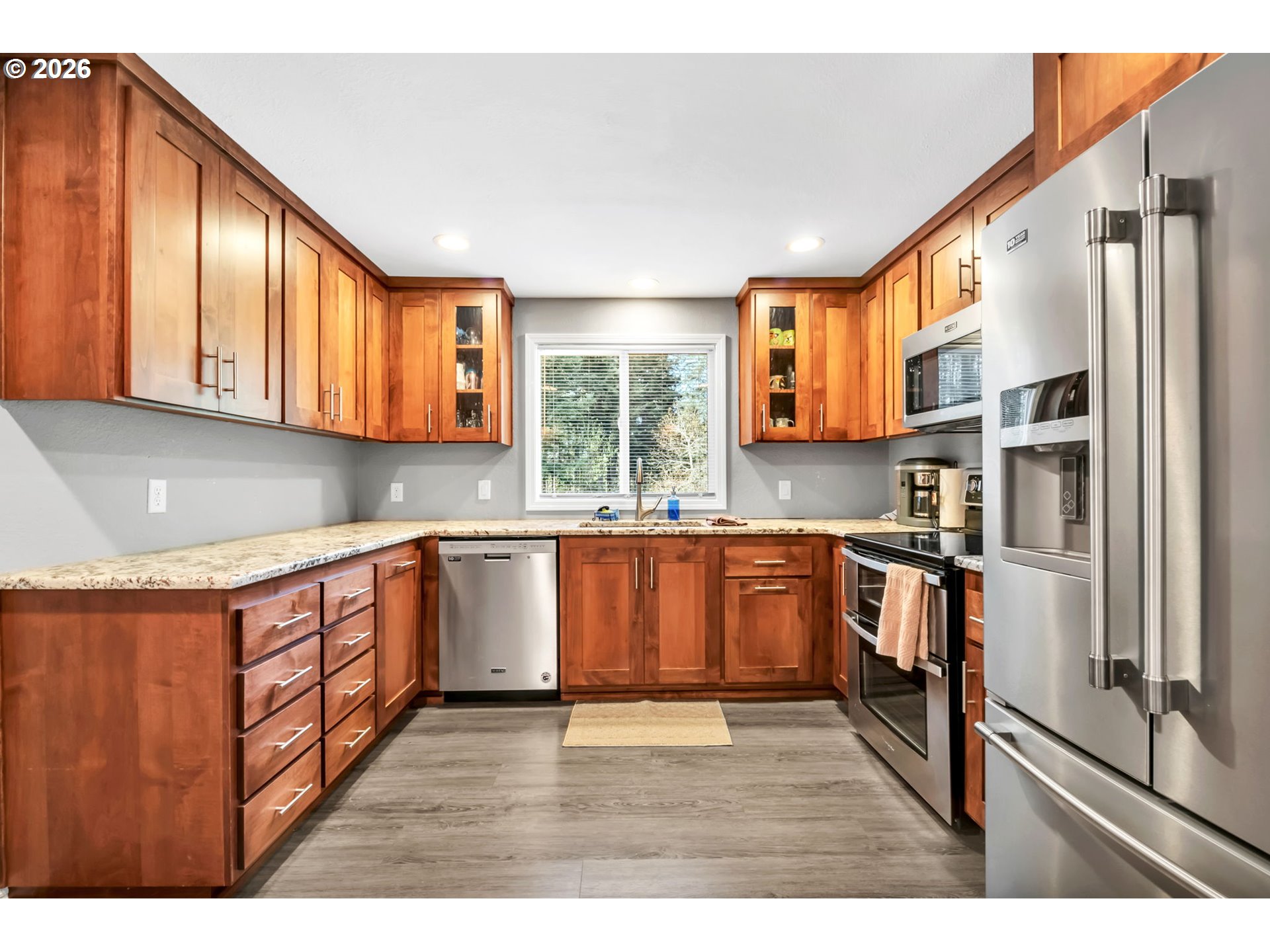 88020 Keola Court Springfield, OR 97478 - Photo 11 of 48 a kitchen with stainless steel appliances granite countertop a refrigerator and a stove top oven