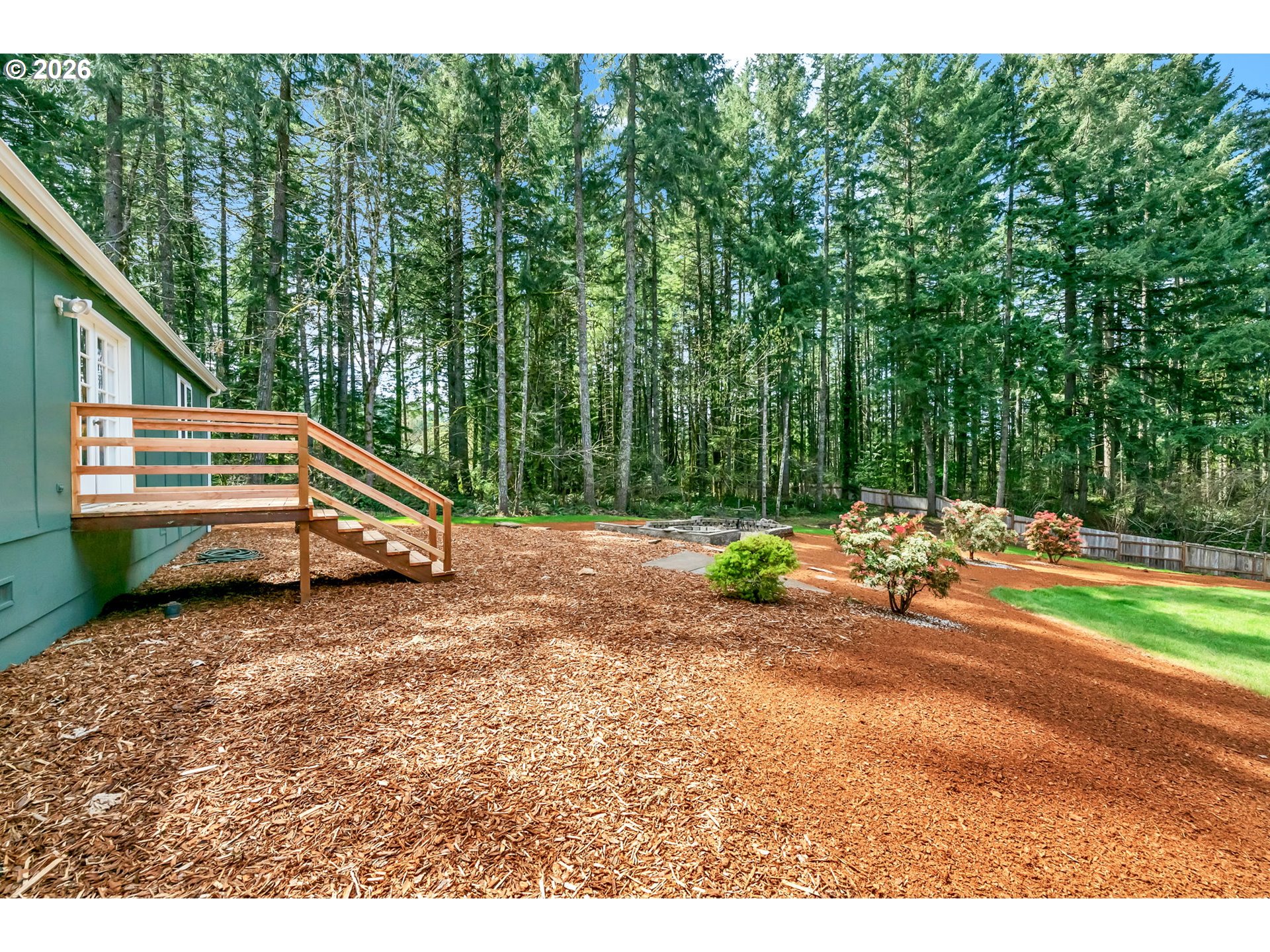 88020 Keola Court Springfield, OR 97478 - Photo 33 of 48 a backyard of a house with table and chairs