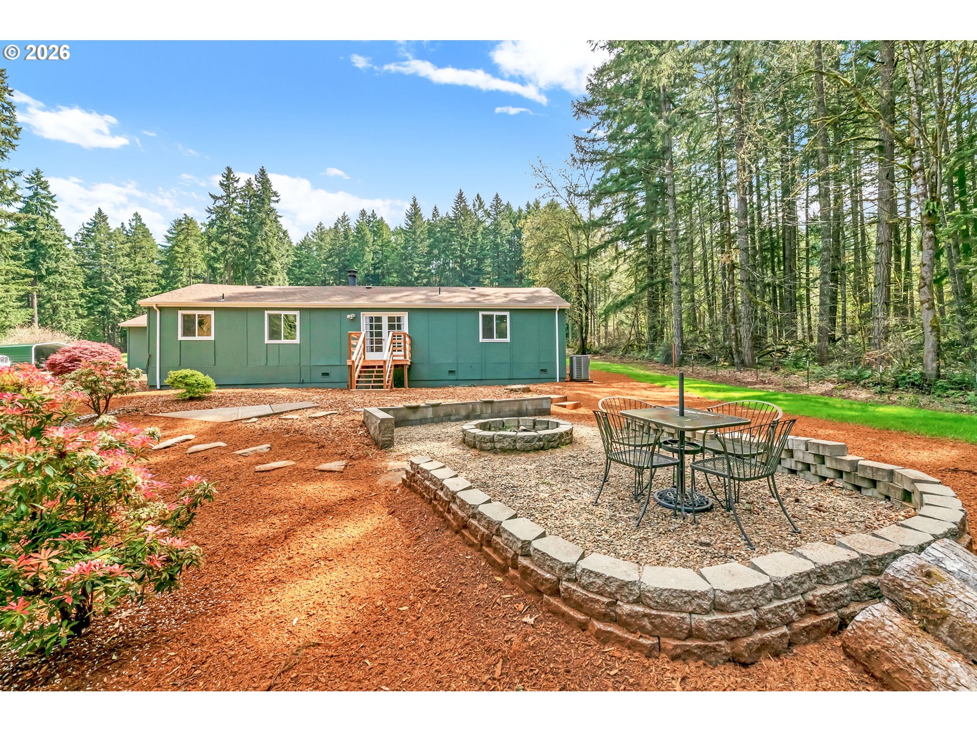 88020 Keola Court Springfield, OR 97478 - Photo 38 of 48 a view of a house with backyard and sitting area