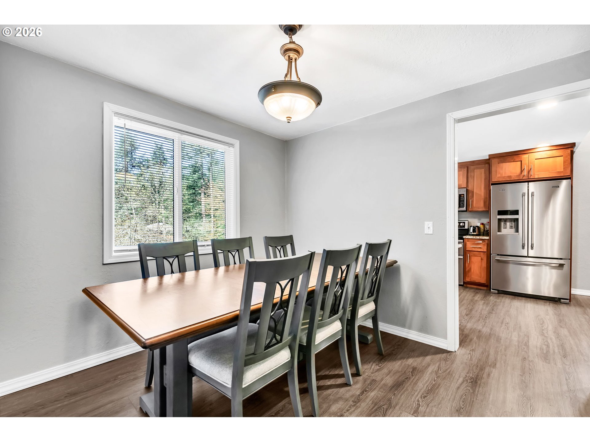 88020 Keola Court Springfield, OR 97478 - Photo 8 of 48 a view of a dining room with furniture window and wooden floor