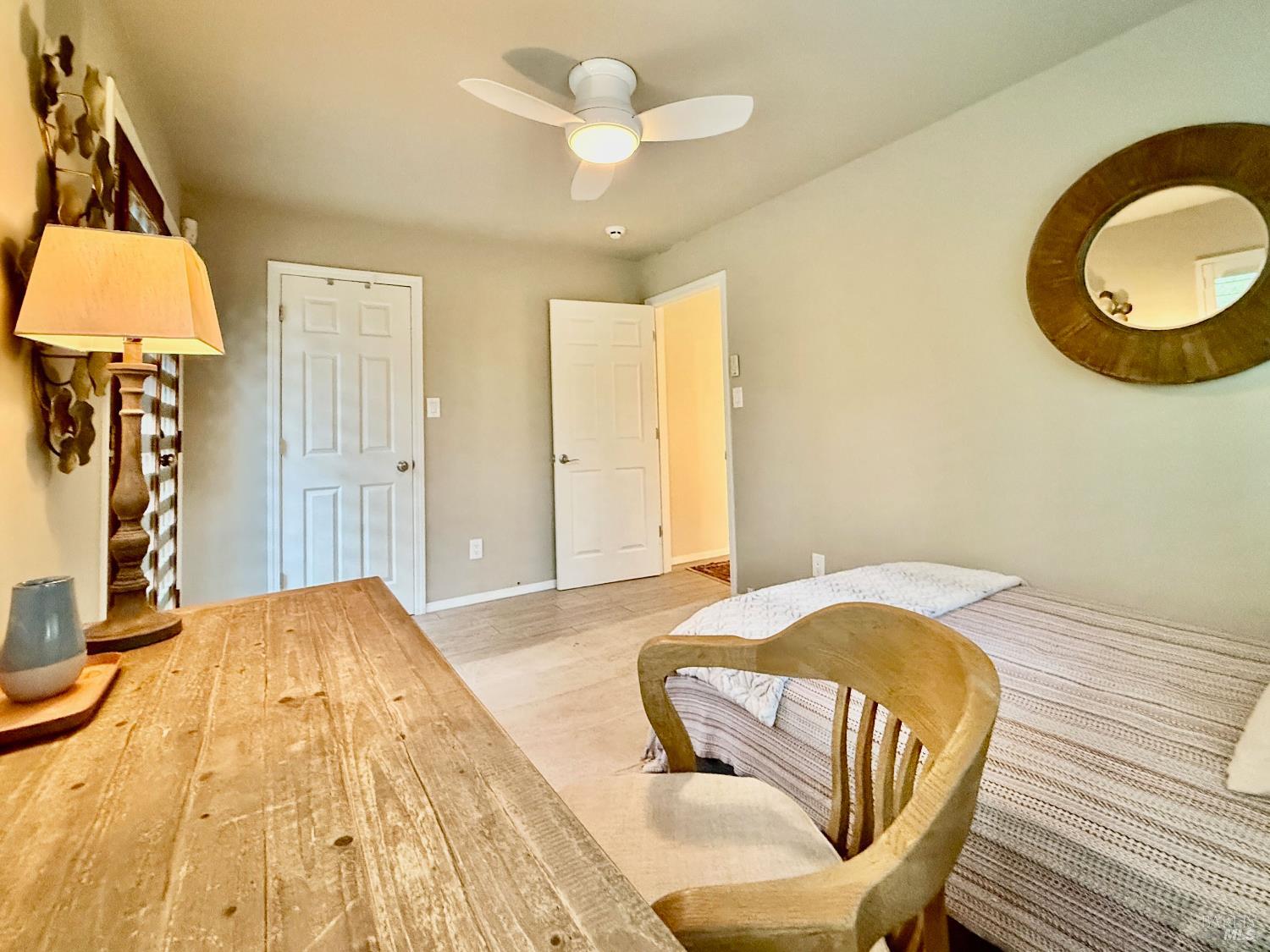 1607 Foothill Boulevard Calistoga, CA 94515 - Photo 15 of 27 a bedroom with a bed and flowerpot