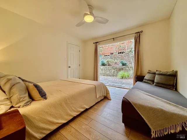 a bedroom with a bed and window
