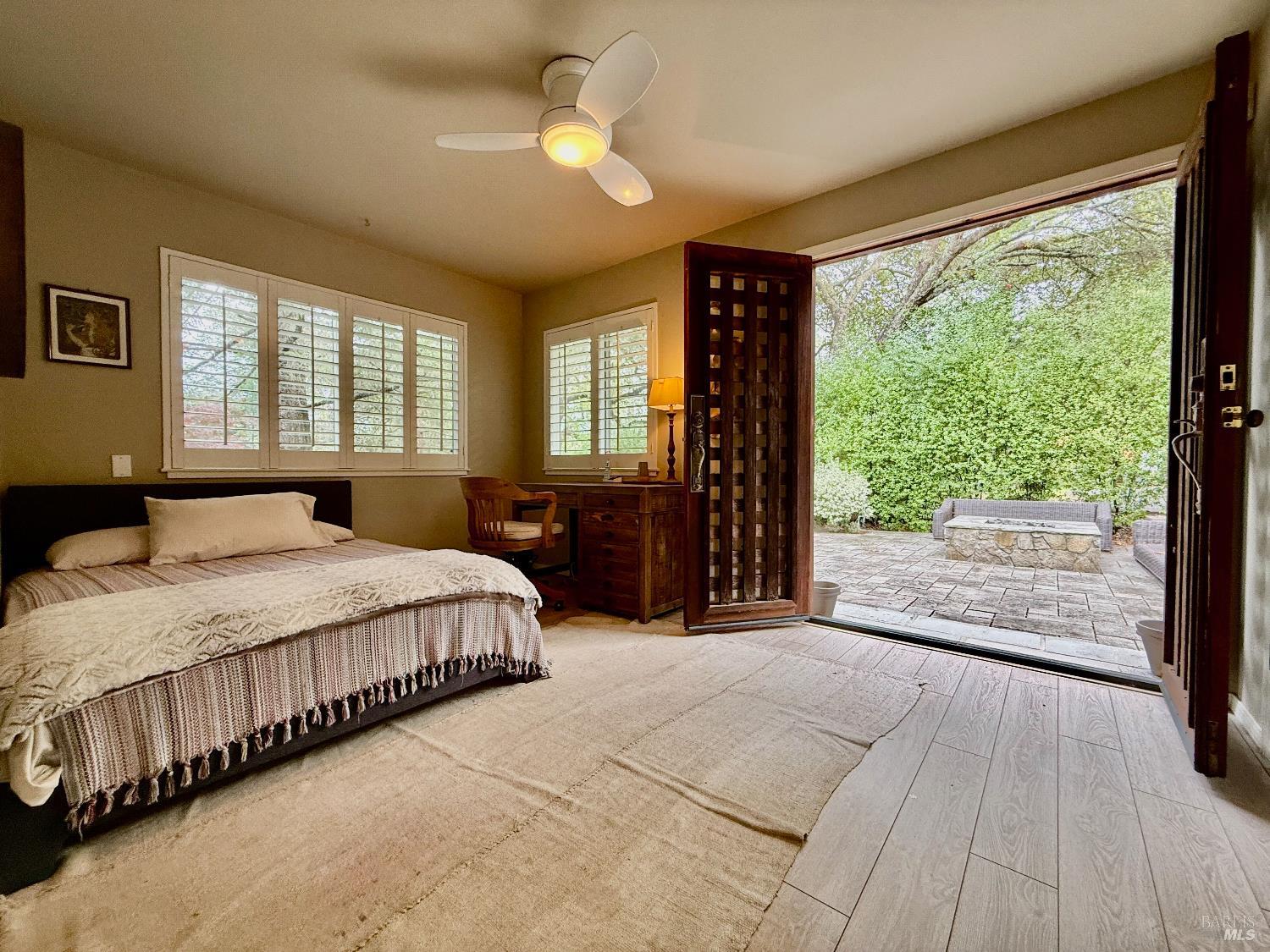 1607 Foothill Boulevard Calistoga, CA 94515 - Photo 20 of 27 a bedroom with a large bed and a large window