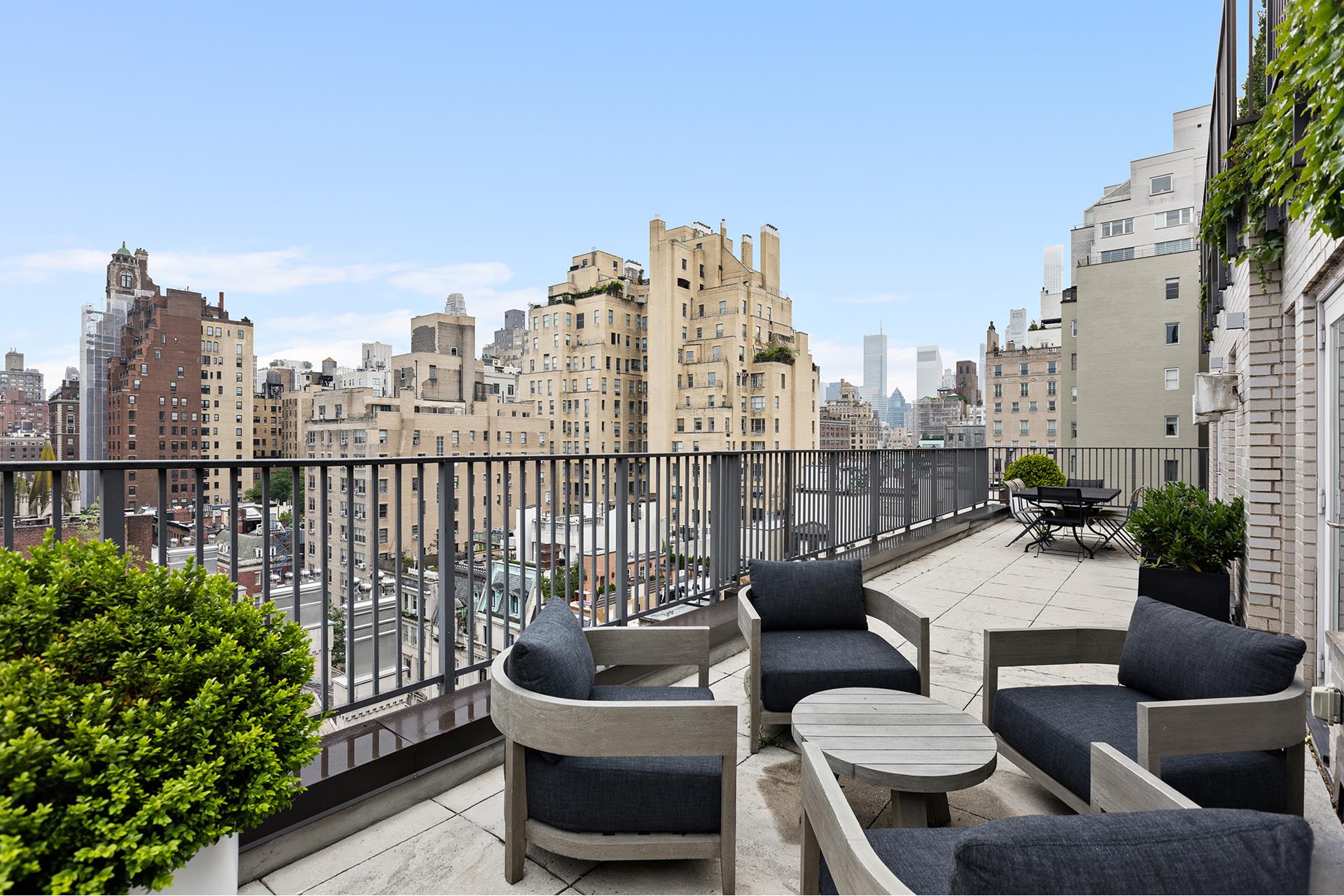 923 5th Avenue, Unit 12E/11 Manhattan, NY 10021 - Photo 12 of 14 a balcony with furniture and a potted plant