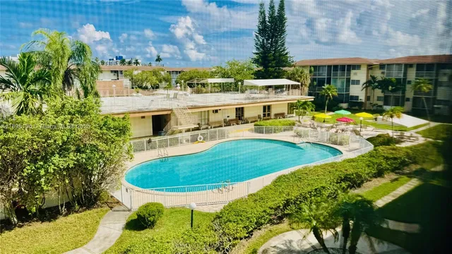 a view of a swimming pool with a patio