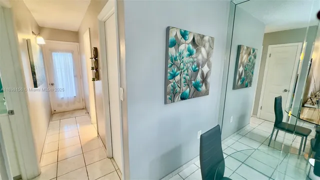 a bathroom with a glass door and a shower