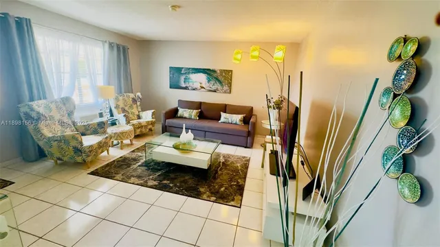 a living room with patio furniture and a window