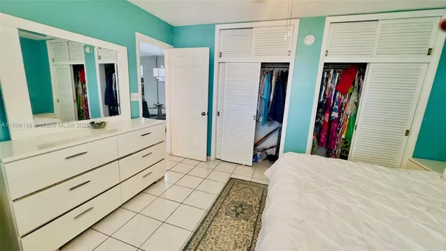 a view of kitchen with furniture and a refrigerator