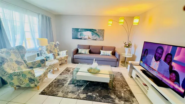 a living room with furniture and a rug