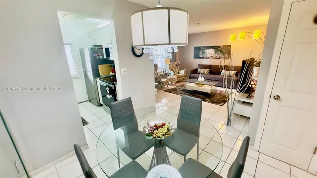 a view of living room with furniture and book shelf