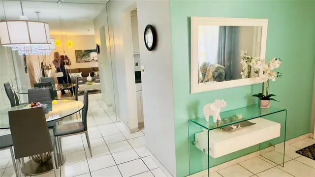 a view of a balcony with chairs and table in a outdoor space