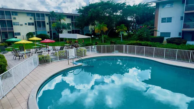 a view of a chairs and table in the patio