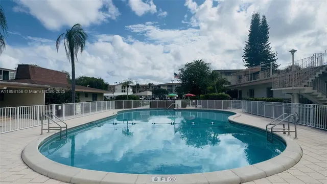 a aerial view of a house with a yard