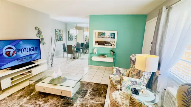 a living room with furniture and a rug