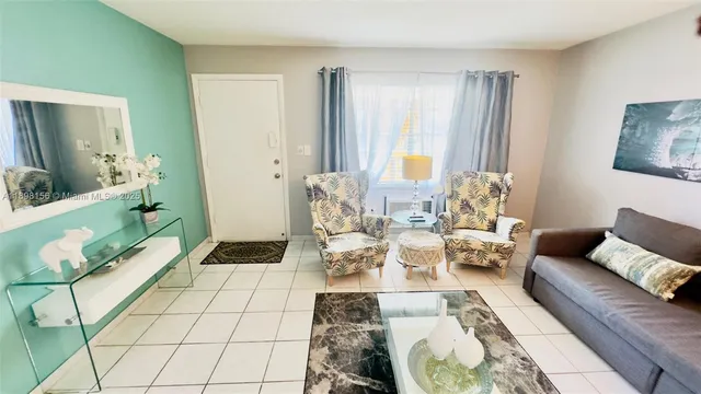 a living room with furniture and a rug