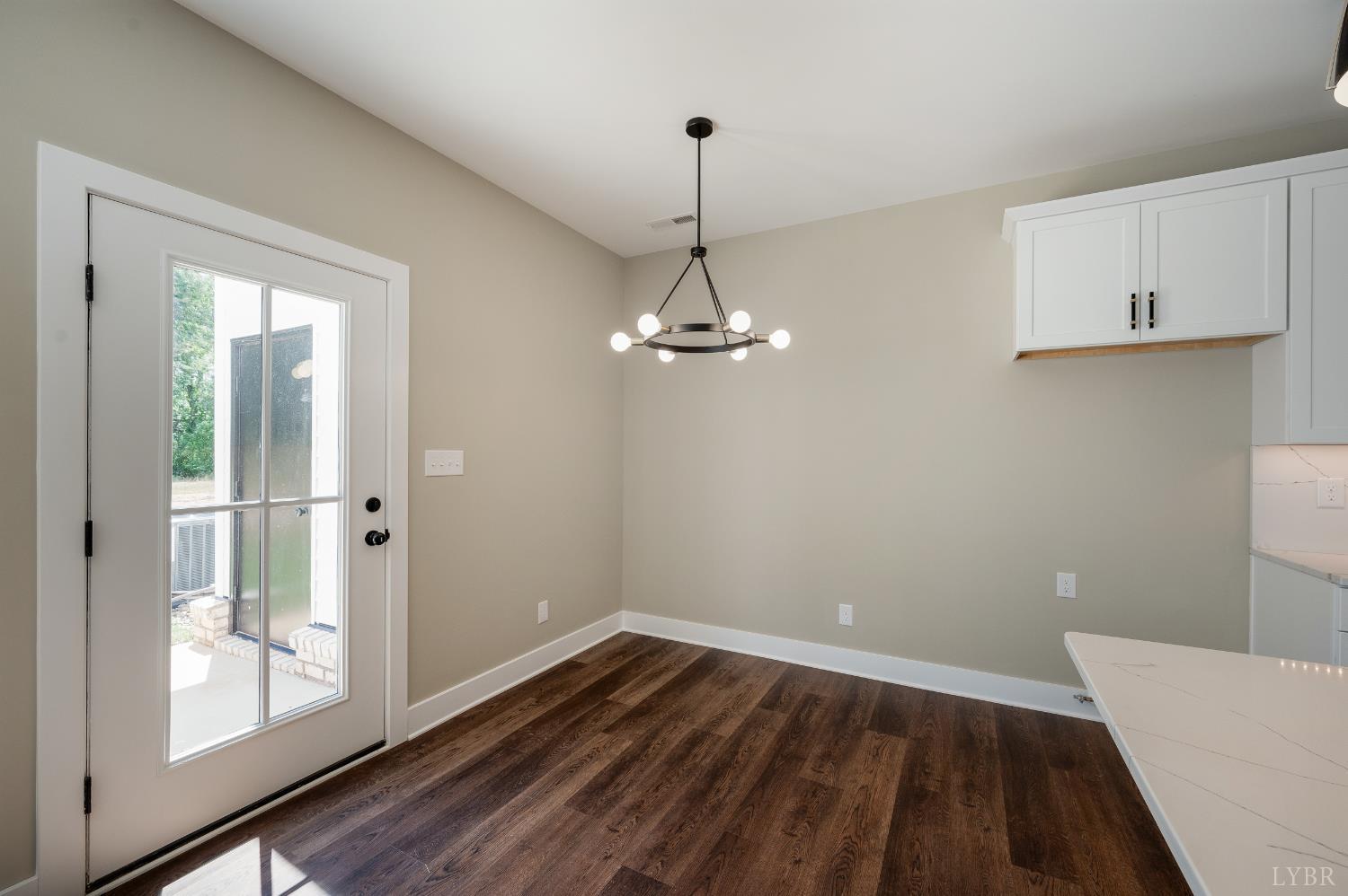 61 Luke Court Rustburg, VA 24588 - Photo 15 of 39 a view of a room with wooden floor and a ceiling fan