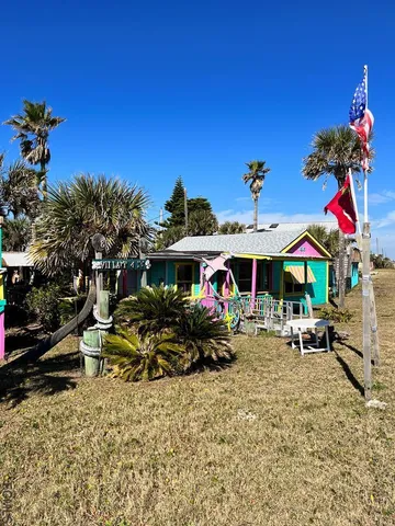 a view of a chairs and table in the patio