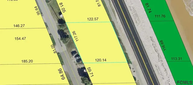 an aerial view of a house with a yard and large tree