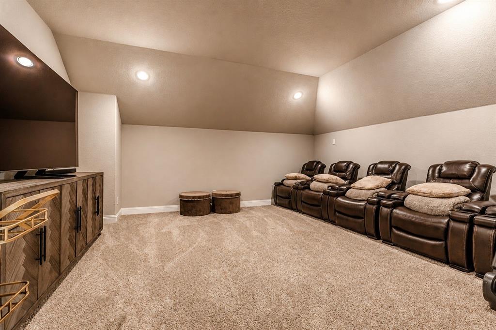 25 Morrison Road Howe, TX 75459 - Photo 18 of 27 Entertainment room featuring a vaulted ceiling with recessed lighting