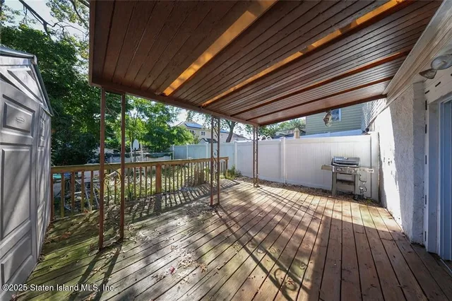a view of backyard with wooden floor