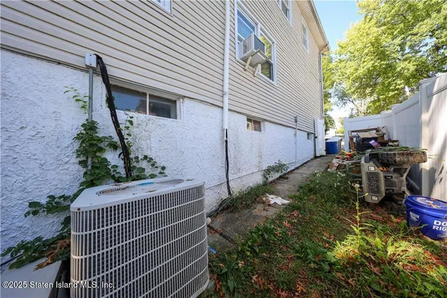 a view of backyard with wheel chair and potted plants