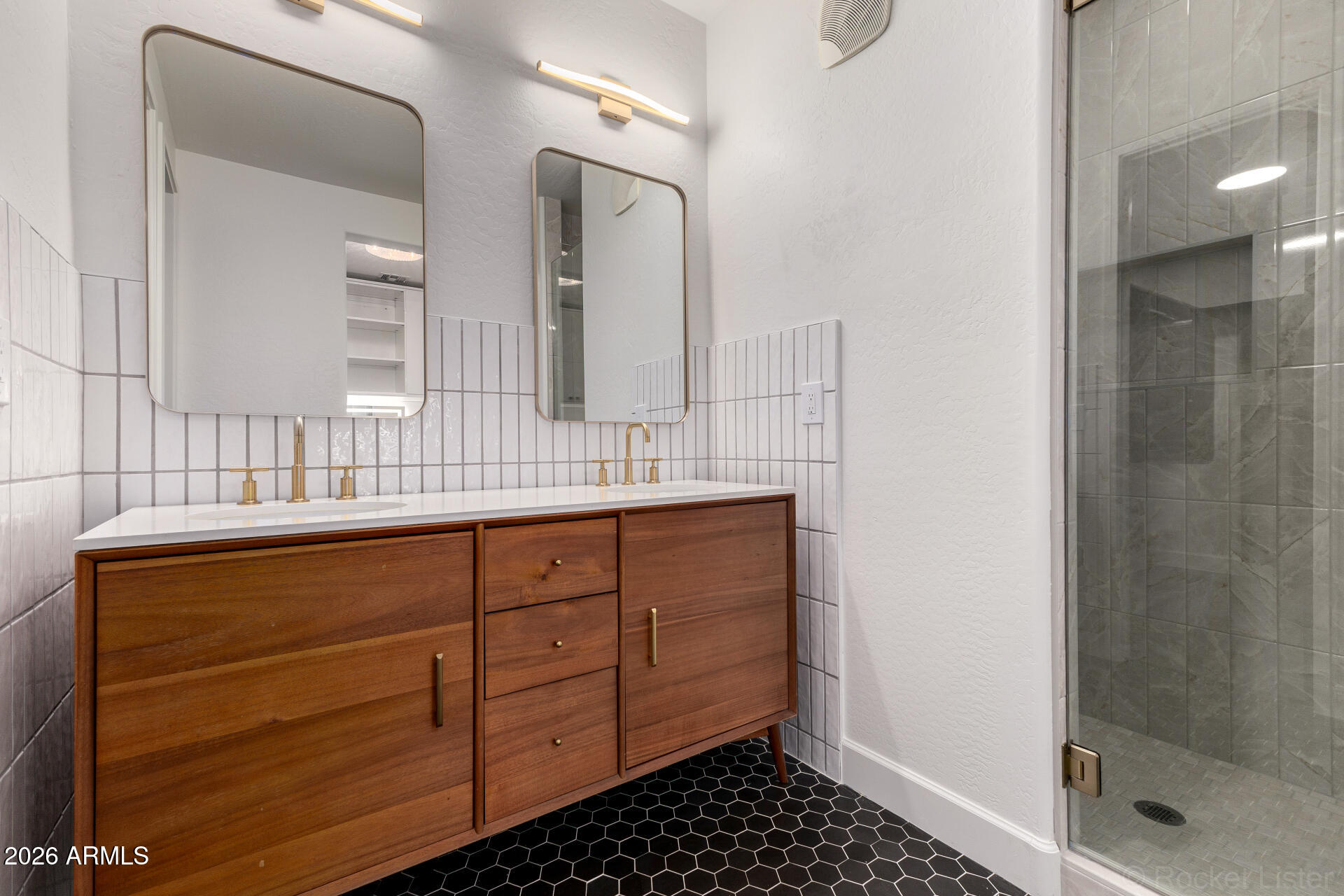 4424 North 24th Way Phoenix, AZ 85016 - Photo 14 of 39 a bathroom with a sink a mirror and shower