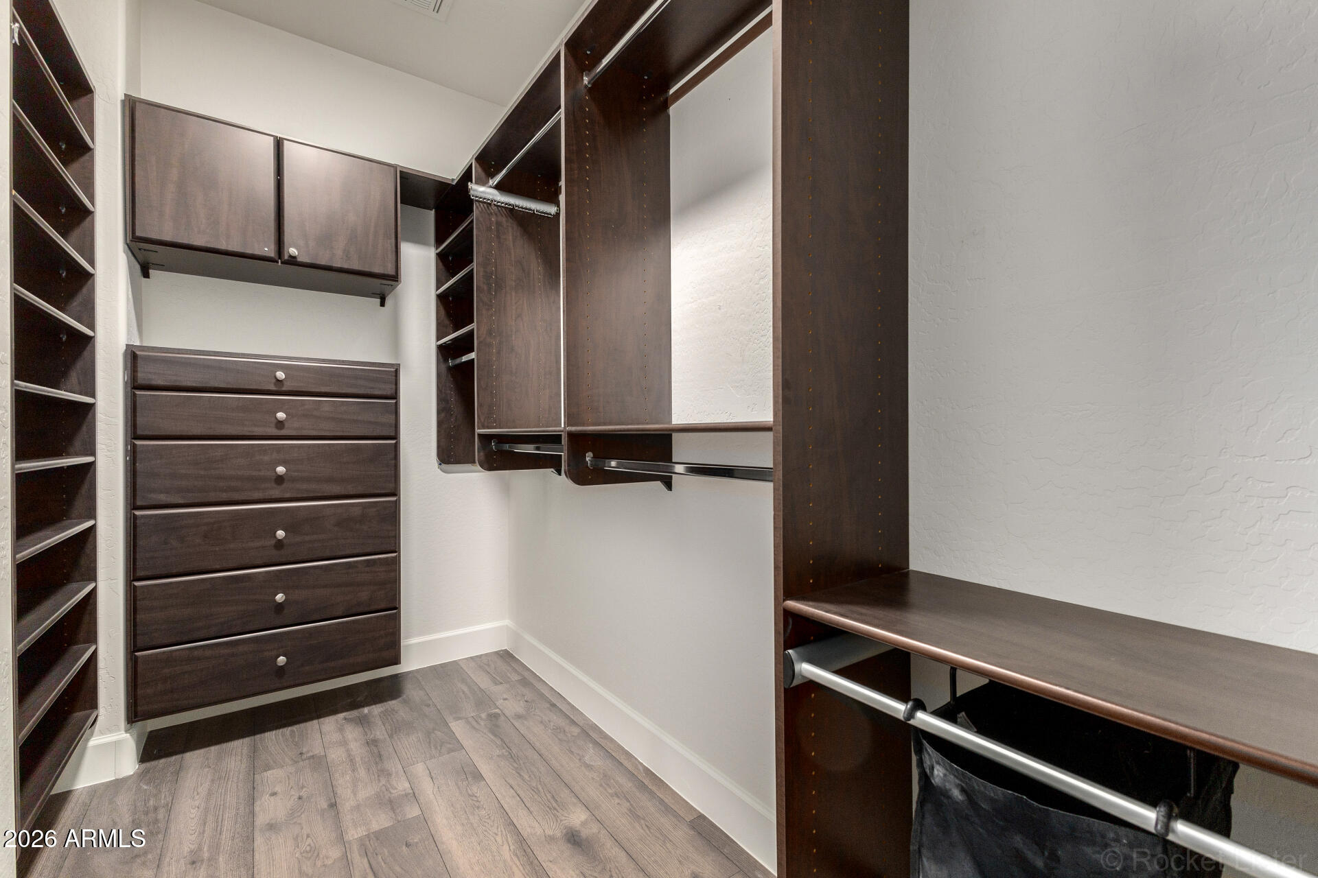 4424 North 24th Way Phoenix, AZ 85016 - Photo 17 of 39 a view of walk in closet with clothes