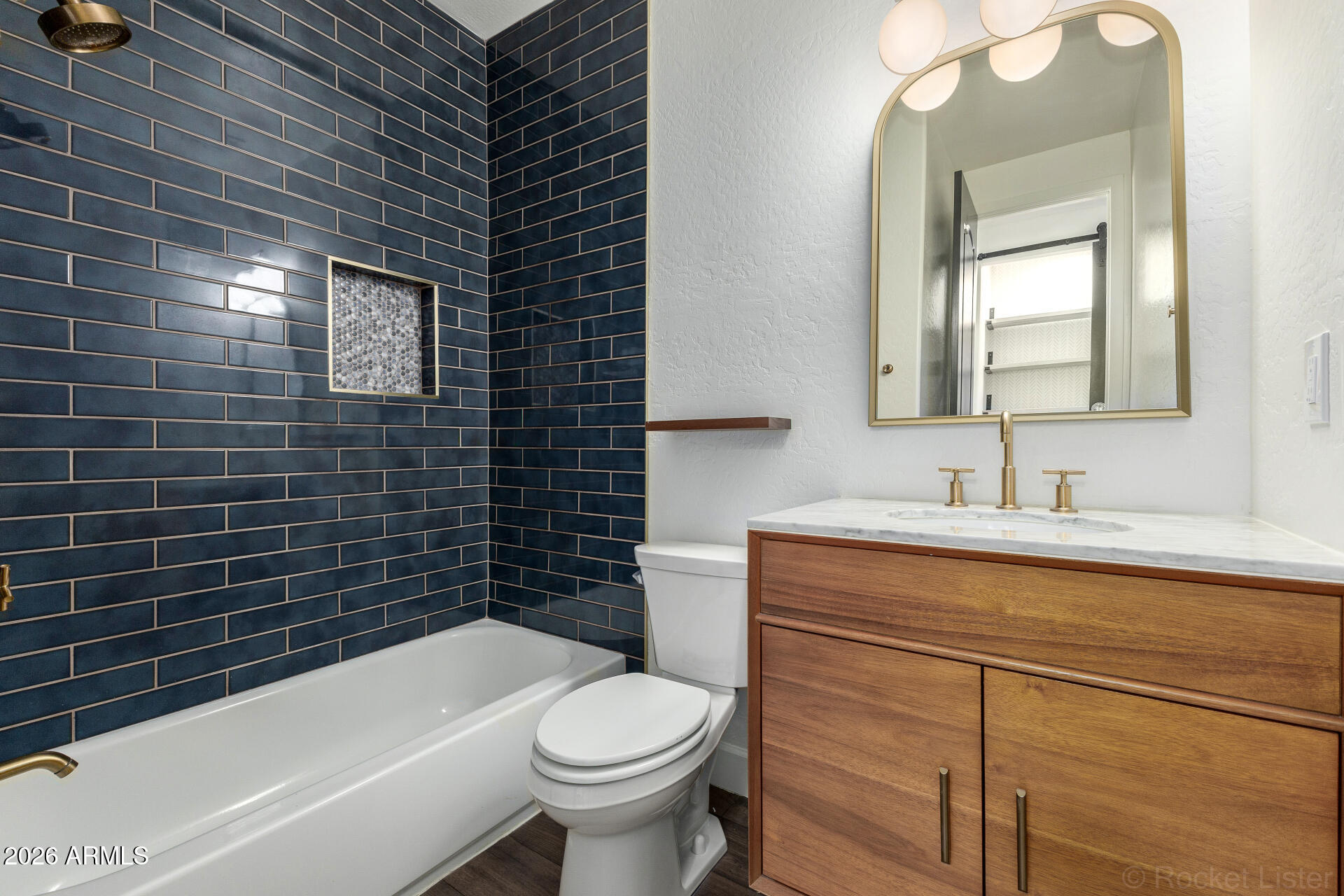 4424 North 24th Way Phoenix, AZ 85016 - Photo 23 of 39 a bathroom with a sink a toilet and bathtub