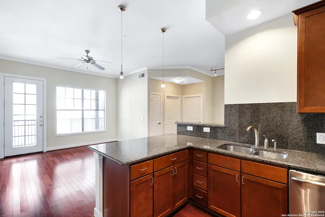 a kitchen with sink and window