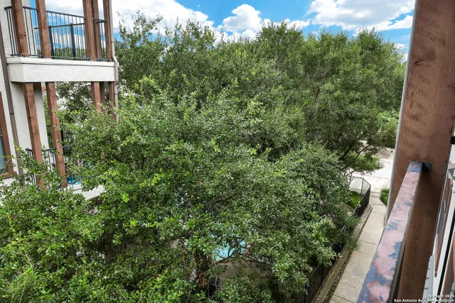 a view of a house with a tree