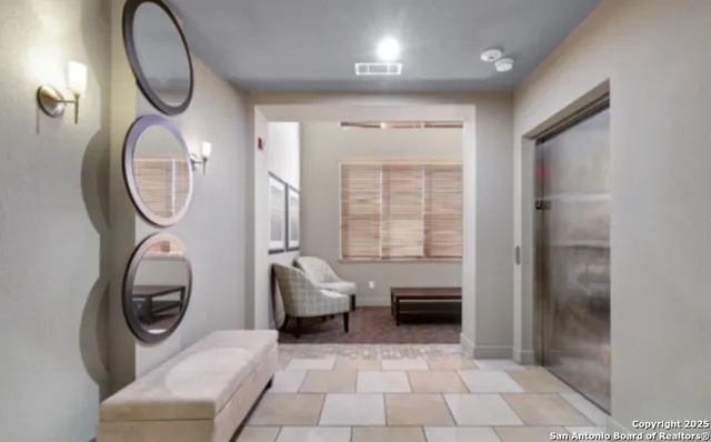 a view of a livingroom with washer and dryer