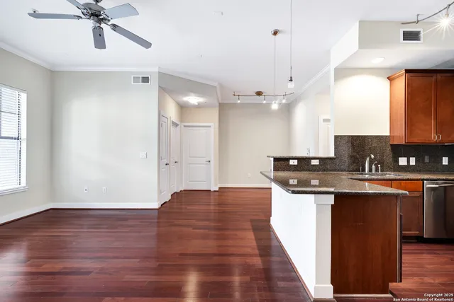 a view of kitchen with sink microwave and stove