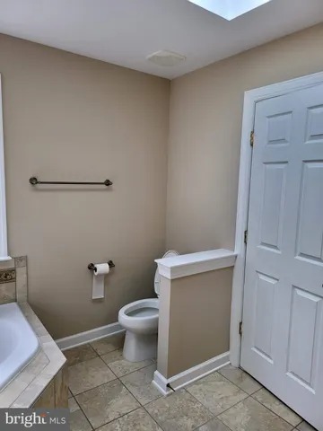 a bathroom with a toilet and a sink